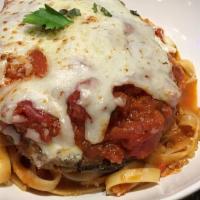 Chicken Parmesan · Breaded chicken breast topped with tomato sauce, mozzarella, and parmesan cheeses. Served ov...