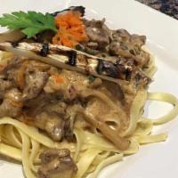 Beef Stroganoff · Sauteed pieces of sirlioin beef, onions, mushroom, and sour cream sauce. Served with pasta.