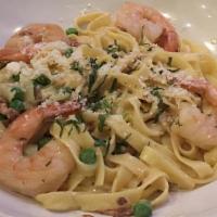 Shrimp Scampi · Pan-seared shrimp in a garlic, butter & lemon sauce and beurre blanc. Served with pasta.