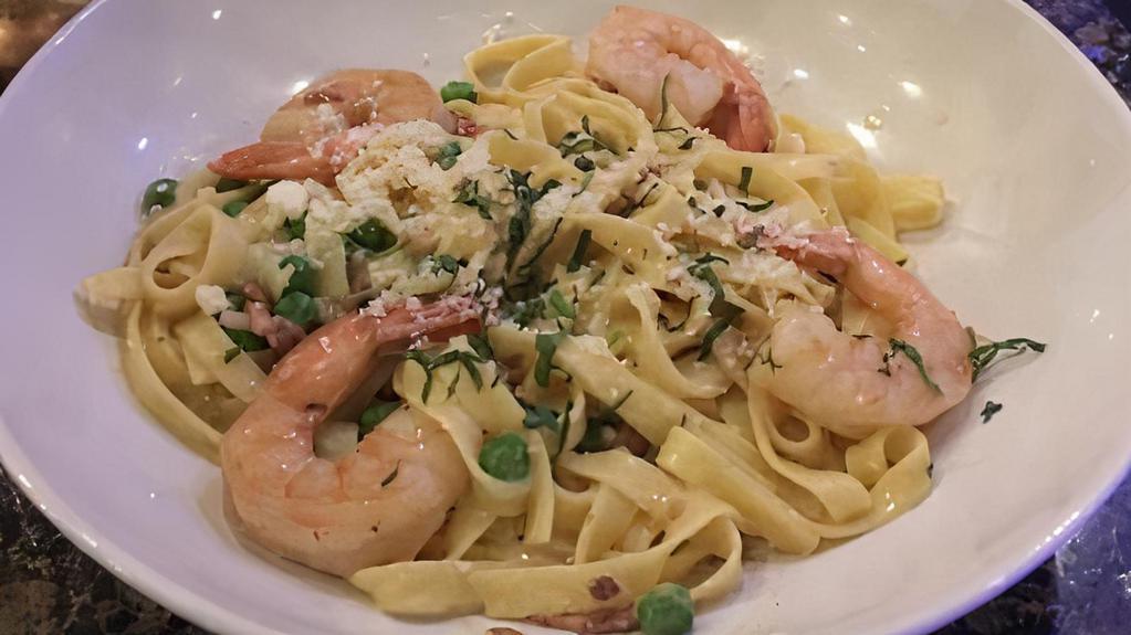 Shrimp Scampi · Pan-seared shrimp in a garlic, butter & lemon sauce and beurre blanc. Served with pasta.