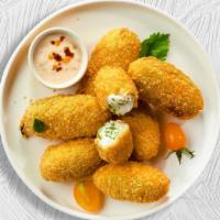 Jalla Heat Popper  · (Vegetarian) Fresh jalapenos coated in cream cheese and fried until golden brown.