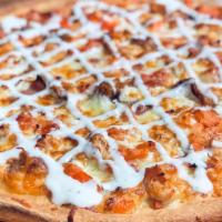 Chicken Ranch Pizza · A white base pizza with grilled chicken, bacon, tomatoes, topped with ranch dressing.