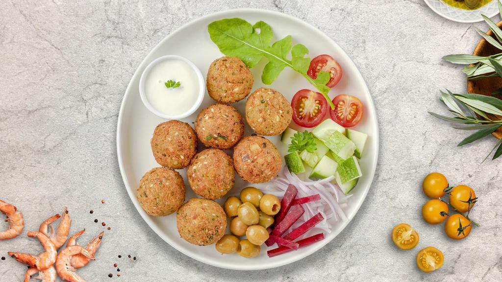 Falafel Club Only · Fried chickpeas, fava beans, cumin, parsley and onions. Served with tahini sauce.