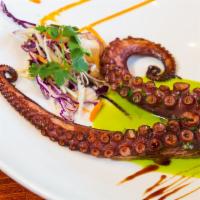 Pulpo Asado Al Chimichurri · Grilled octopus, lime, and chimichurri sauce.