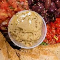 Hummus Platter Vegan · “Hummus, roasted peppers, and bruschetta served with toasted slices of our homemade panini b...
