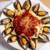 Seafood Spaghetti · Shrimp, black mussels and home made marinara sauce over spaghetti with garlic and parmesan.