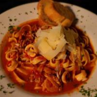 Pasta Camamari · Cooked on a tomato spicy sauce
