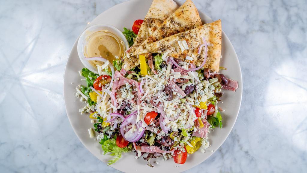 Chopped Salad · Assorted meats and cheeses, tomato, red onion, olive, pepperoncini, red wine vinaigrette, focaccia