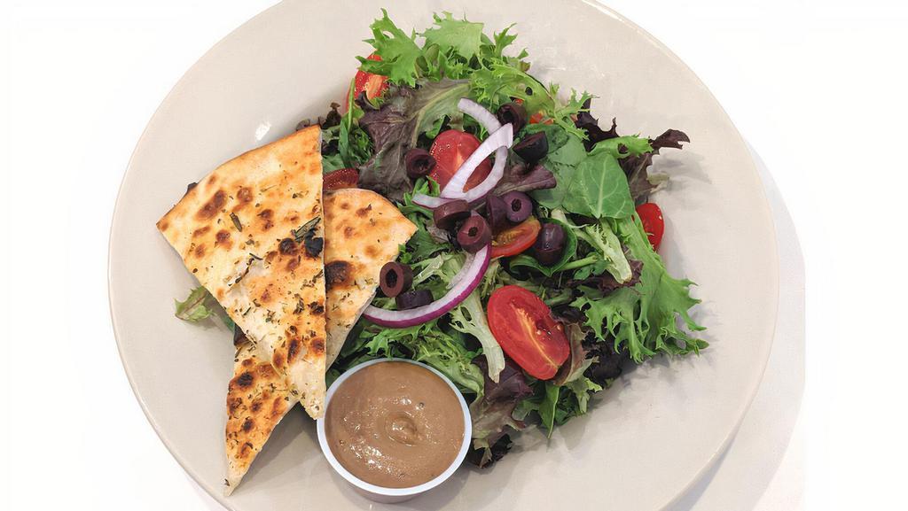 House Salad · Mixed greens, tomato, olives, red onion, house-made balsamic vinaigrette, focaccia