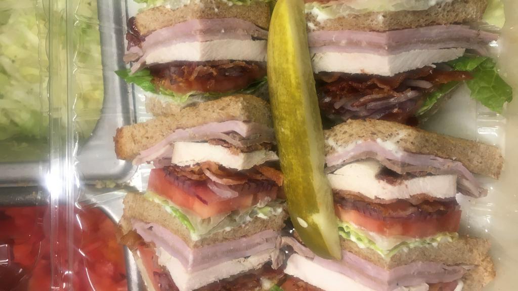 Triple Decker Club · Ham, turkey and roast beef, served with lettuce, tomato, bacon, mayo, chips and a pickle.