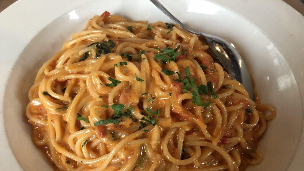 Spaghetti Bolognese · Spaghetti tossed in our homemade fresh tomato and meat sauce.