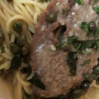Spaghetti Alla Puttanesca · Kalamata olives, capers and garlic, homemade marinara, spaghetti pasta.