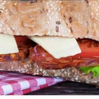 Turkey Club · Turkey, bacon, swiss cheese, lettuce, tomatoes, and mayo served on three pieces of toasted w...