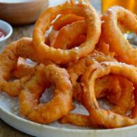 Onion Rings · A portion of onion rings served with ketchup.