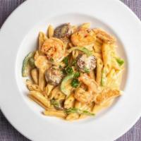 Mozzarella Specialty · Grilled shrimps, chicken and sausage, green peppers with penne in our Cajun
Alfredo sauce.