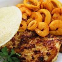 Surf & Turf Arepa / Arepa Mar Y Tierra · Shrimp - calamari with onions and grill chicken breast / camarones-calamares con cebollas y ...