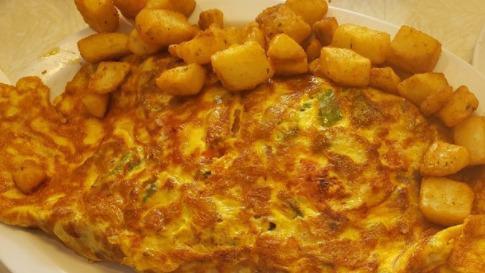 Hash & Cheese Omelet · Consuming raw or undercooked meats, poultry, seafood, shellfish, eggs, or unpasteurized milk may increase your risk of food-borne illness, especially if you have certain medical conditions.