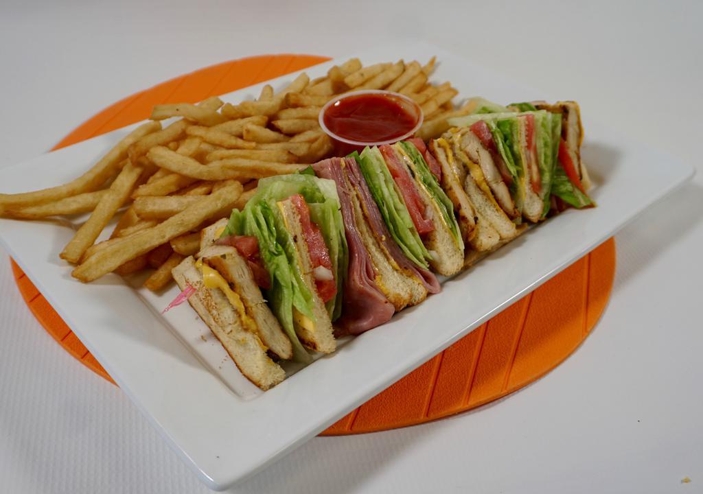 Club Sandwich · Classic club sandwich with chicken and ham, American cheese, lettuce, tomato and mayonnaise served with French fries.