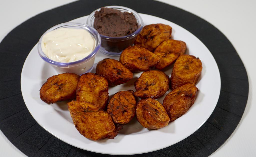 Platanos Fritos · Fried plantain served with refried beans and sour cream.