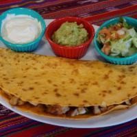 Quesadilla · Served with guacamole, sour cream and pico de gallo.