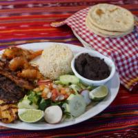 Plato Mixto · Mix grilled of beef, chicken, shrimp and marinated pork loin (carne adobada) served with ric...