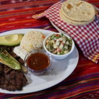Churrasco · Grilled marinated fajita meat served with green onions, rice, refried beans, homemade salad,...