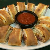 Catania Roll · Salami, Ham and Provolone Cheese, Rolled in Pizza Dough, with a side of Marinara Sauce