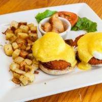 Crab Benedict · English muffin topped with two crab cakes and poached *eggs and covered in rich Hollandaise ...
