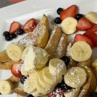 Mom'S French Toast · Our French toast bread, dipped in Mom's style custard batter and grilled golden, dusted with...