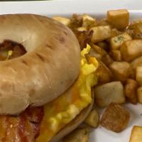Bacon & Egg Sandwich · One scrambled *egg, two bacon strips and cheese on a toasted bagel. Served with breakfast po...