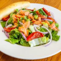 Smoked Salmon Salad · Romaine and spinach, tossed in lemon vinaigrette. Topped with roasted red tomatoes, red onio...