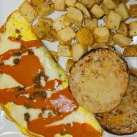 Green Chile Cheese Omelet · Three *eggs, diced green chiles, onions, chorizo, mozzarella cheese. Topped with ancho chipo...