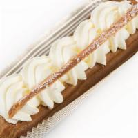 Vanilla Éclair · Choux pastry with vanilla bean custard and sweetened whipped cream.