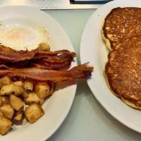 The Plus · Two eggs, home fries, bacon, ham or sausage and 2 pancakes.
