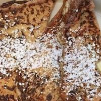 Half French Toast · 2 pieces of Brioche Bread dipped in our Homemade French toast batter.