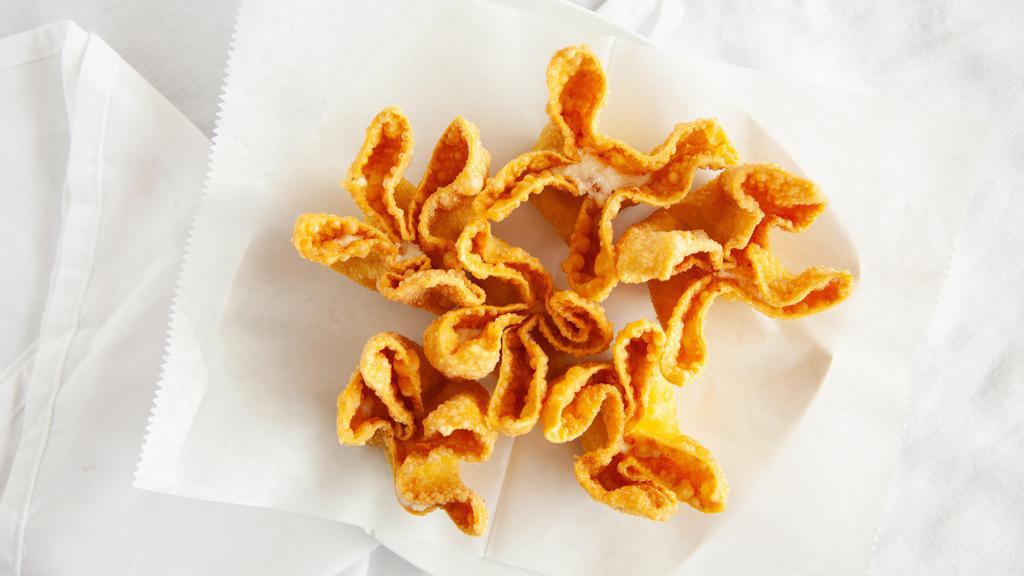 Crab Rangoon (6) · Each wonton is fully stuffed with a creamy mixture of crab meat, scallions, and cream cheese.