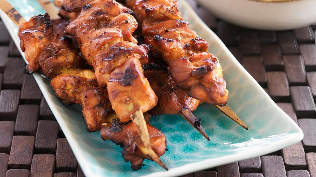Satay Chicken (4) · Thread marinated chicken on skewers are packed full of flavor.