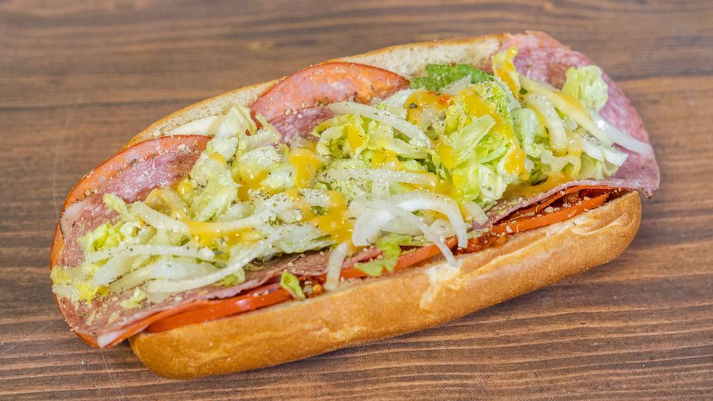 Italian Cold Cut · Salami, prosciuttini ham, capicola and provolone dressed with lettuce, tomatoes, onions, mild hots, Italian dressing, Parmesan and spices.