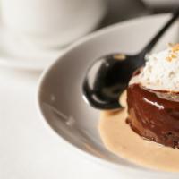 Flourless Chocolate Cake · A flourless chocolate cake drizzled with hot fudge and topped with our whipped cream.