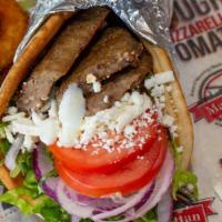Classic Gyro · Gyro meat, lettuce, tomato, red onion, feta cheese, and gyro sauce.
