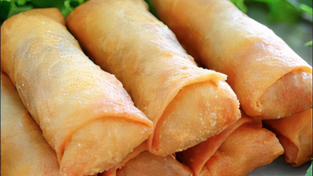 Egg Roll · Green cabbage, carrot, noodles, seasoning rolled in a egg roll wrapper and fried. Served with home- made mango sauce