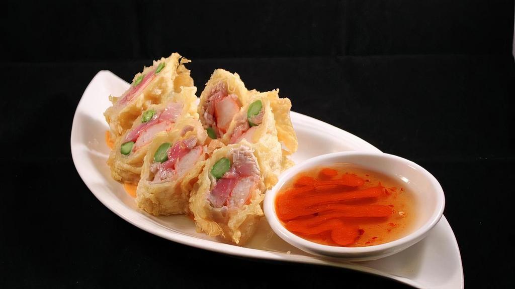 Simply Roll · Sushi grade tuna, imitation crab and asparagus, rolled with an egg roll wrapper, tempura battered and . fried. Served with spicy sweet and sour sauce . *Tuna served rare unless otherwise requested