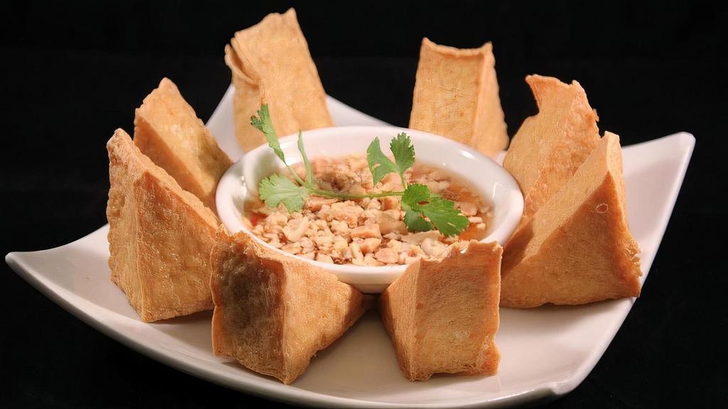 Crispy Tofu · Crispy fried tofu served with homemade sweet and sour sauce topped with crushed peanuts.