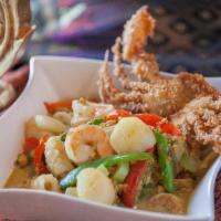 Talay Jaa · Shrimp, scallop, and calamari rings stir fried with fresh vegetables in a mild, creamy curry...