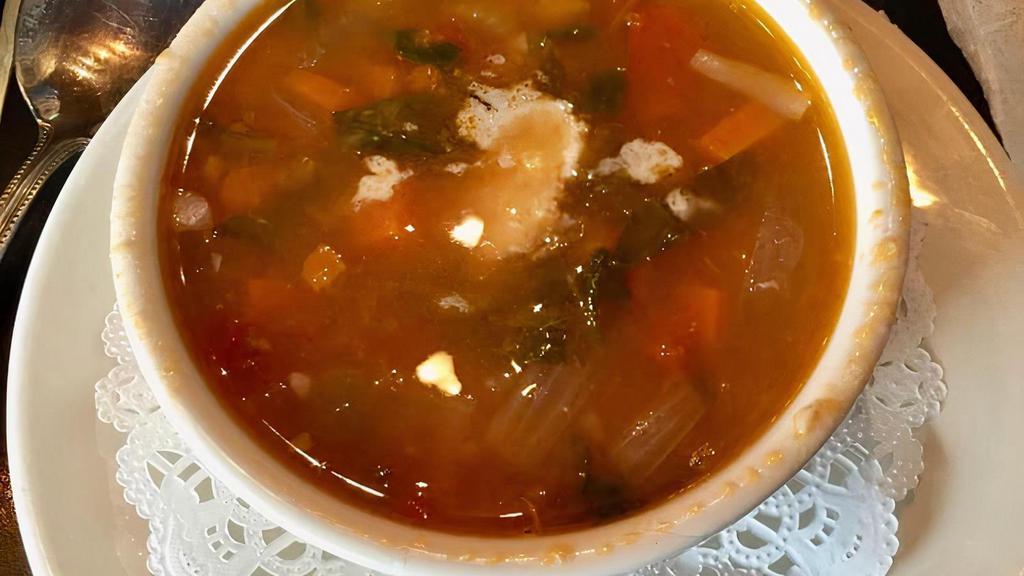 Soup Du Provence · WHITE BEANS, COLLARDS GREENS, FIRE ROASTED TOMATOES, CARROTS, CELERY, ONIONS TOPPED WITH PARMESAN