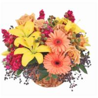 Sun-Kissed Country Floral Arrangement · This beautiful basket is sure to make them smile! Overflowing with gorgeous copper roses, bu...