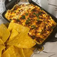 Buffalo Chicken Dip · Made with lots of shredded chicken breast Served with fresh      in-house made tortilla chips.