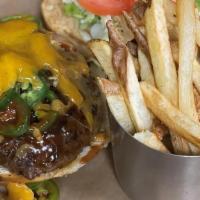 Cowboy Burger · BBQ, Cheddar, Caramelized Onions, & Jalapenos.