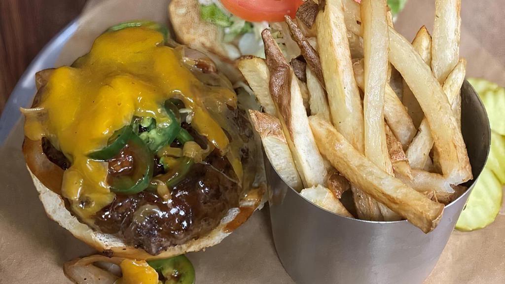 Cowboy Burger · BBQ, Cheddar, Caramelized Onions, & Jalapenos.