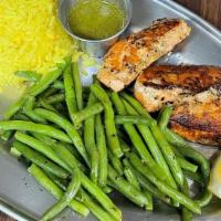 Atlantic Grilled Salmon · Fresh Atlantic salmon marinated then grilled to perfection served with rice & Vegetables.